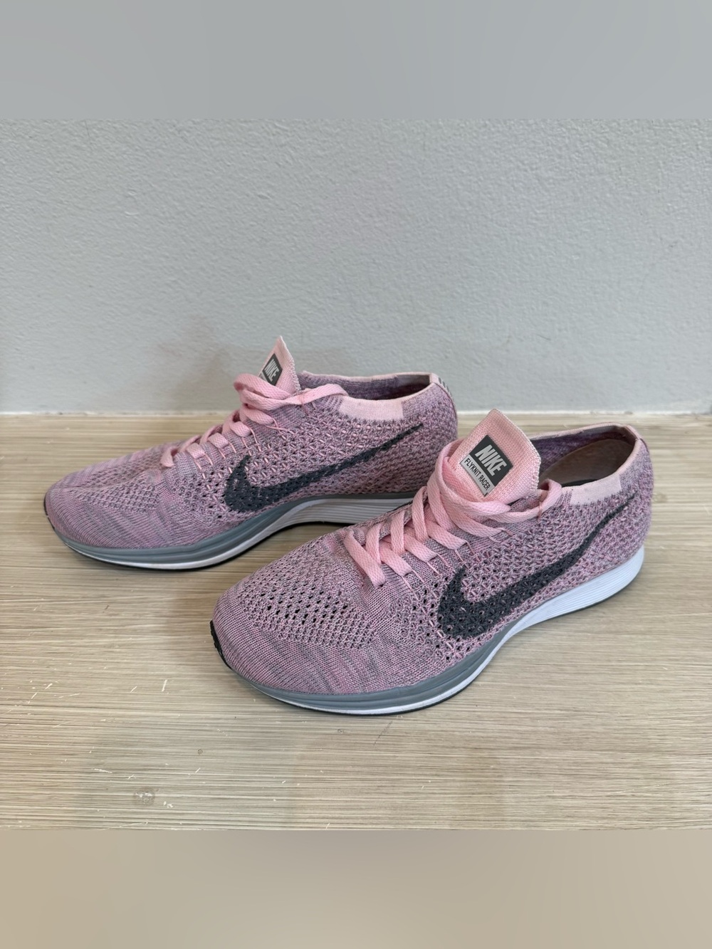 Nike women’s Flyknit Running Shoes Light Pink with Dark Charcoal Swoosh size 5.5